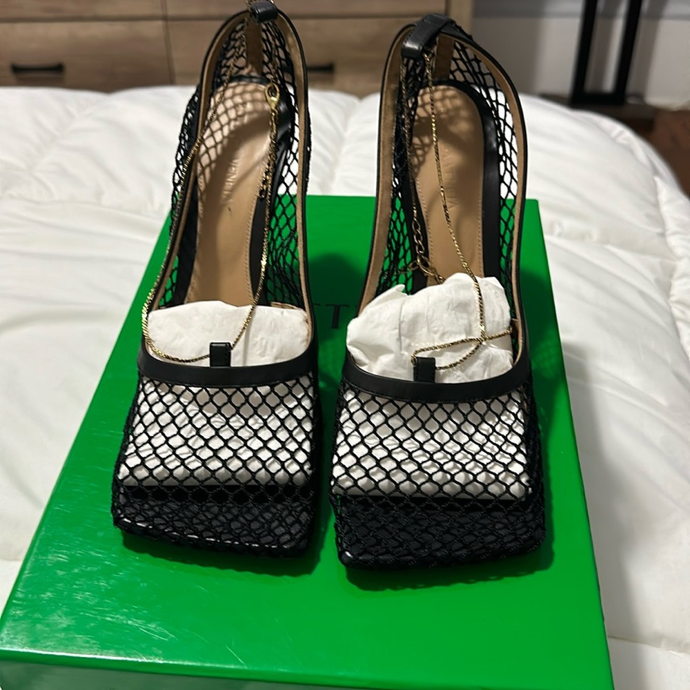 BOTTEGA VENETA
Chain-embellished leather and mesh heeled courts